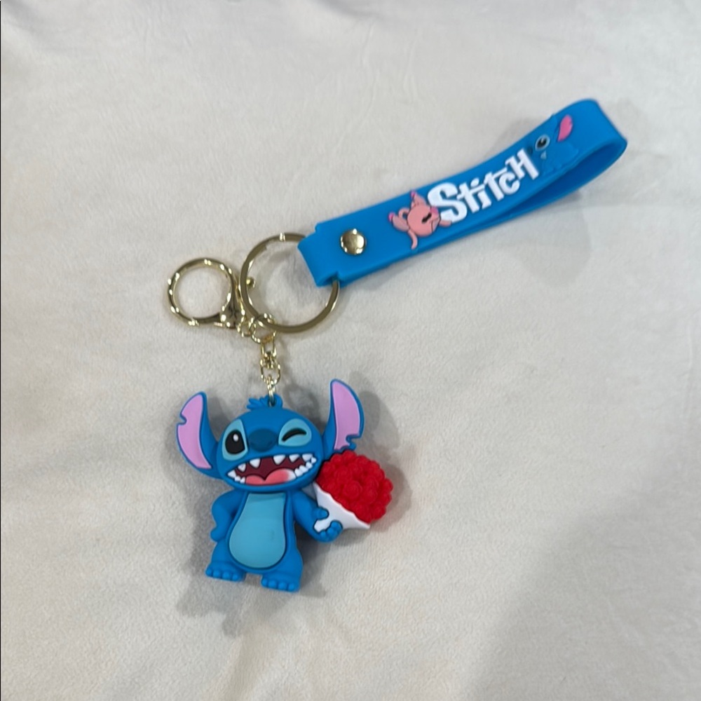 Stitch Blue Keychain him holding a flower bouquet with Red Accents